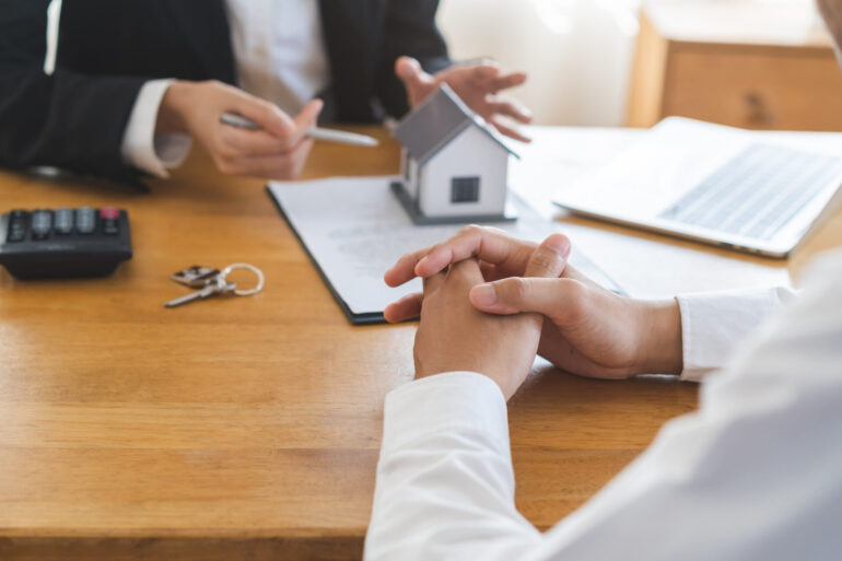 Real estate, banker present house model with client before tenant sign contract rental purchase buyer home with landlord, realtor after agreement mortgage success done. Property lease agent concept.