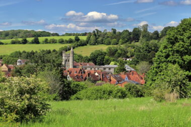 Looking down on the rooftops of Amersham Old Town in the English Chiltern Hills in Buckinghamshire, with Church Tower and rolling countryside