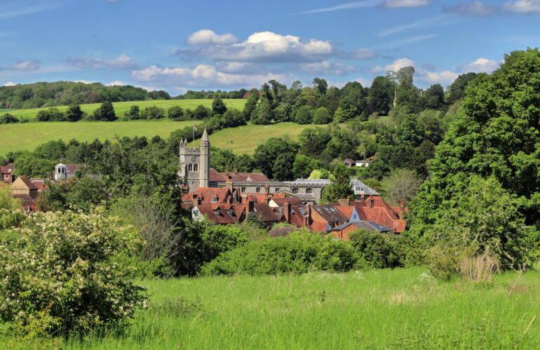 Looking down on the rooftops of Amersham Old Town in the English Chiltern Hills in Buckinghamshire, with Church Tower and rolling countryside