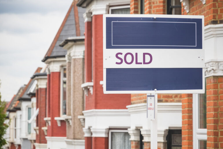 Sold sign displayed outside a terraced house in Harringay, London