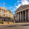Royal Exchange and Bank of England buildings in City of London, UK (translation "founded in thirteenth year of Queen Elizabeth, and restored in eighth of Queen Victoria")