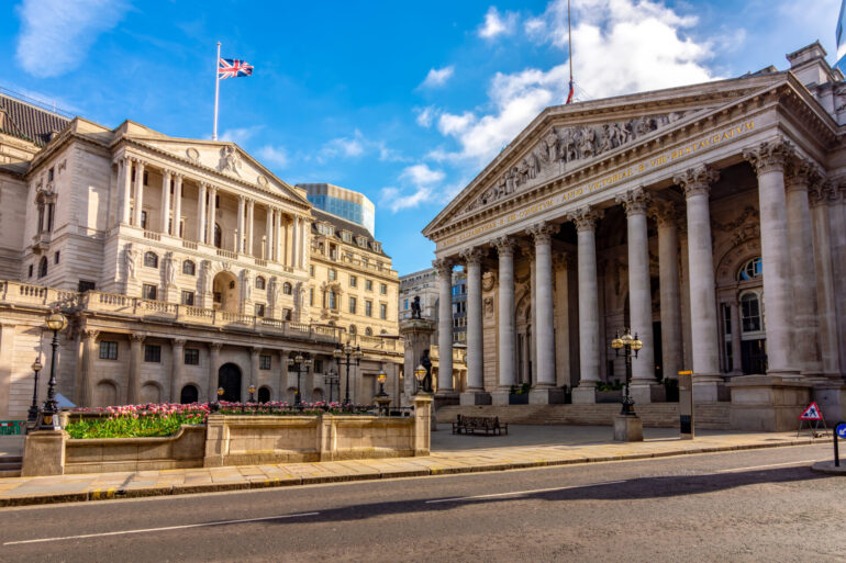 Royal Exchange and Bank of England buildings in City of London, UK (translation "founded in thirteenth year of Queen Elizabeth, and restored in eighth of Queen Victoria")
