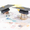 student debt Mortar board on british pounds