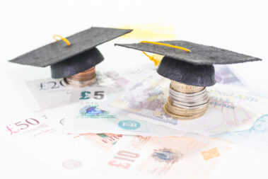 student debt Mortar board on british pounds