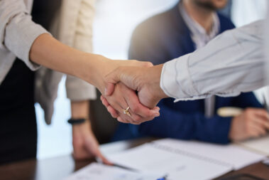 B2b, shaking hands and thank you handshake of a corporate worker in a office. Business deal, partnership and we are hiring gesture with a female hr manager ready for onboarding welcome with trust.